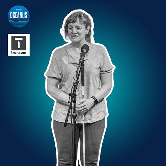 Physical oceanographer Amy Bower speaks in front of. a microphone