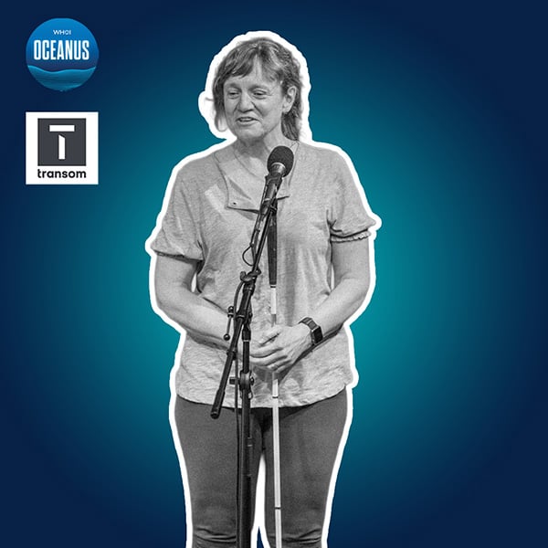 WHOI physical oceanographer Amy Bower speaks in front of microphone.